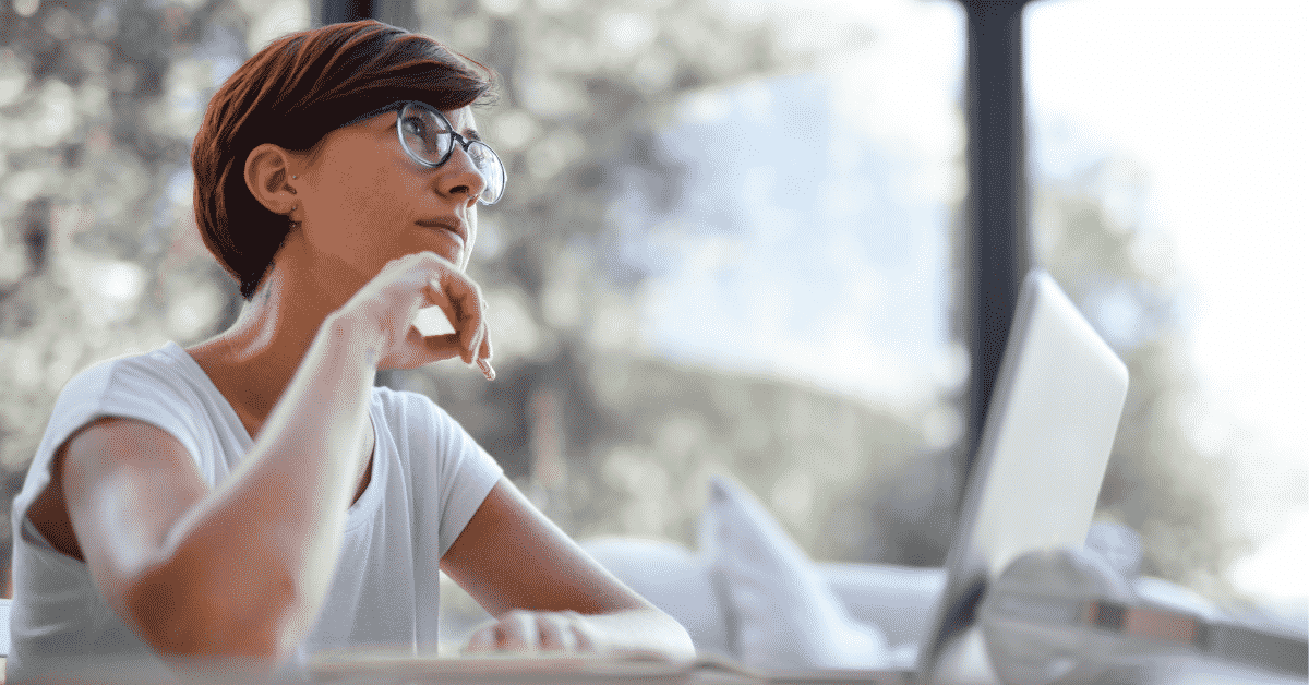Womam at a laptop searching for a buyer's agent