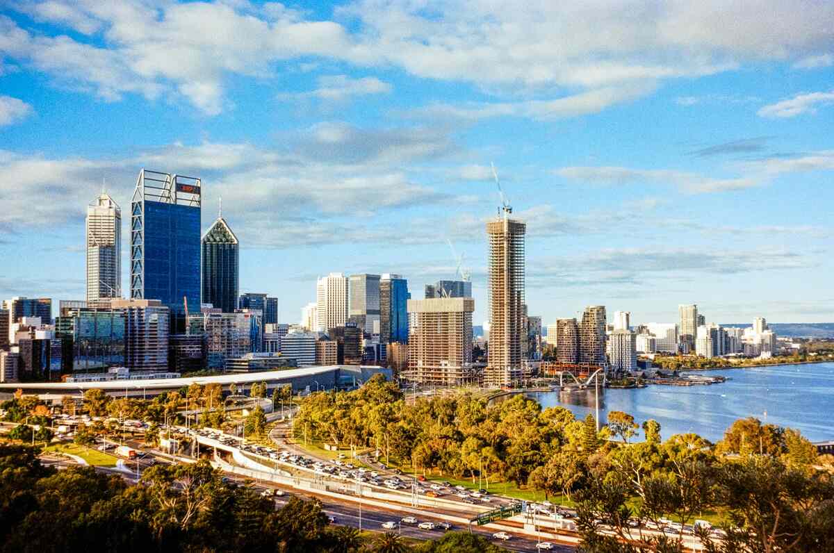 Perth city skyline with river and trees: A picturesque view of Perth's skyline, with the river flowing alongside and trees adding a touch of greenery.